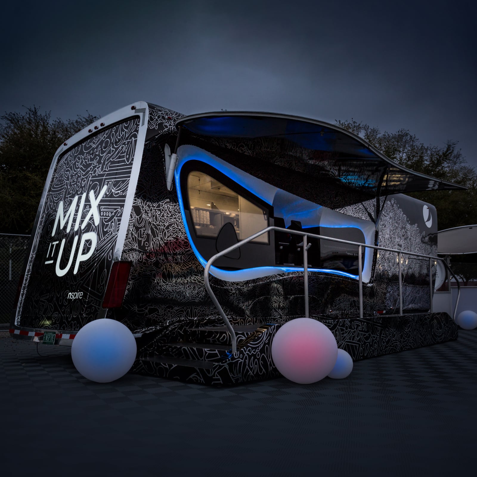 23Fuse_CaseStudies_NSPIRE_Images_4MEK_FeaturedImage NSPIRE trailer with lights at night